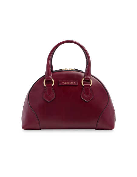Borsa a mano in pelle con tracolla e silhouette arrotondata The Bridge Magda – Barolo/Oro - foto 1